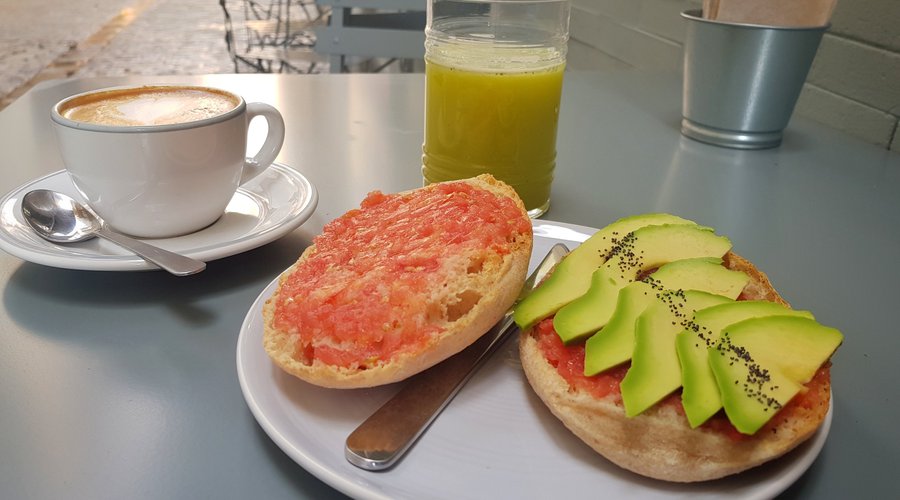 Tomato and avocado toast with green apple, kiwi, pineapple and mint cold pressed juice.