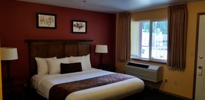 Royal Victorian Motel in Port Angeles, image may contain: Bed, Furniture, Painting, Lamp