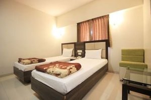 Hotel Prime in Ahmedabad, image may contain: Hotel, Interior Design, Resort, Furniture