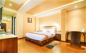 Divinity by Audra Hotels in Mathura, image may contain: Corner, Flooring, Wood, Interior Design
