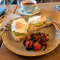 Custom made, poached eggs and avocado on sour dough! Yum!