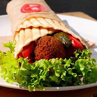 falafel wrap with fresh vegetables and homemade sauces
