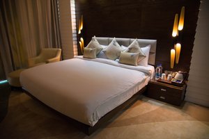 Golden Blossom Imperial Resorts in Lucknow, image may contain: Cushion, Home Decor, Furniture, Bed