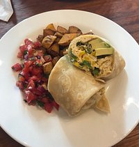 Vegetarian breakfast wrap: Scrambled egg and avacado with salsa and potatoes and option sour cre
