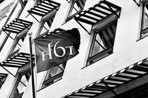 Hotel F6 in Helsinki, image may contain: Brick, Logo, Flag
