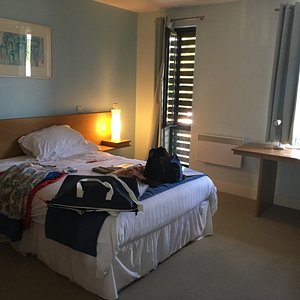Roffey Park Institute in Horsham, image may contain: Bed, Furniture, Handbag, Dorm Room