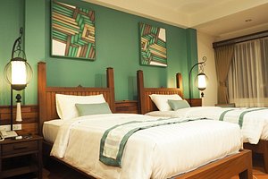 Villa Sanpakoi in Chiang Mai, image may contain: Bed, Furniture, Lamp, Home Decor