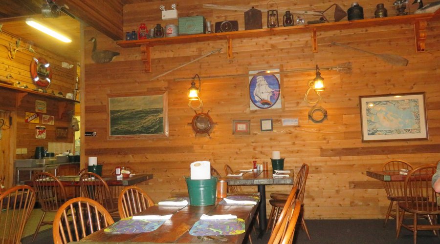 Perfect Decor To Catch the Mood of the Place. Note the Hatch Cover Table