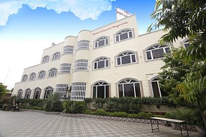 Sheetal Regency Hotel in Mathura, image may contain: Hotel, Villa, Resort, City