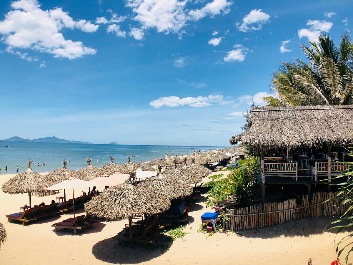 Relaxing scene at An Bang Beach with golden sand and turquoise waters