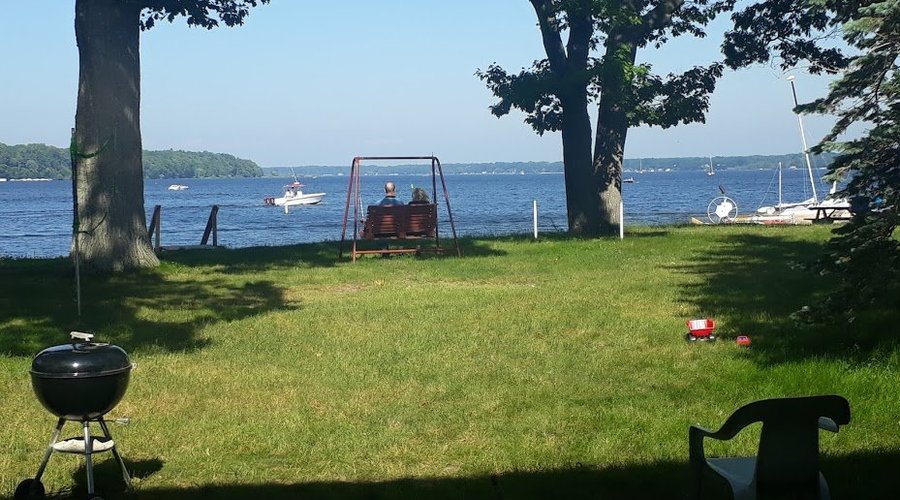 Watching the boats go by from the swing.