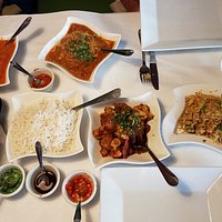 Lamb korma, Assorted naan, chicken biryani, cauliflower, chutneys