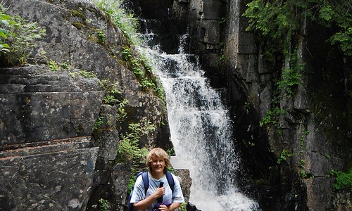 A day hiker takes a break at Little Wilson Falls in the Hundred Mile Wilderness north of Monson.