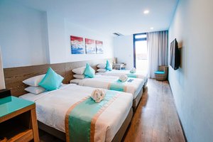 Palau Hotel in Koror Island, image may contain: Dorm Room, Furniture, Bed, Bedroom