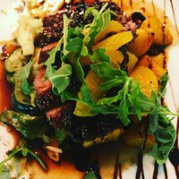 Summer duck breast seared with fresh figs, orange segments, Pedro Ximinez and rocket