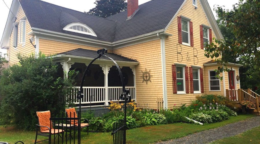 The porch is screened in. The grounds are well-kept.