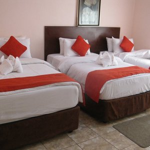 Three beds, 1 double and 2 singles. Fridge, television, bath tub and high speed Internet connect