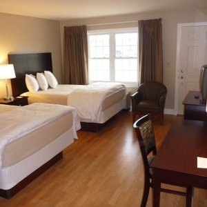 Room with two full size beds.