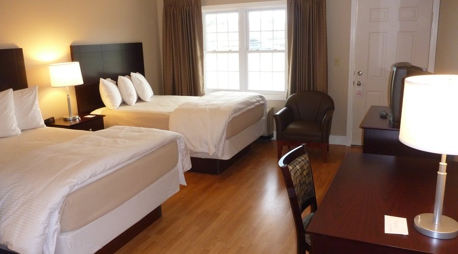 Room with two full size beds.