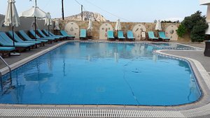 Arkasa Bay Hotel in Kárpathos, image may contain: Resort, Hotel, Pool, Chair