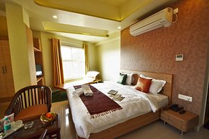 Hotel Banaras Haveli in Varanasi, image may contain: Chair, Bed, Book, Home Decor