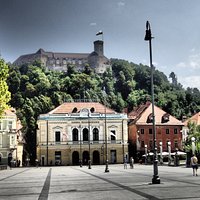 Hall with castle behind up at hill