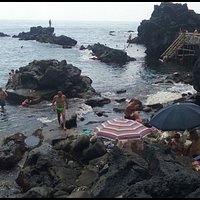 The crowded lava cliffs in the summer season - 1