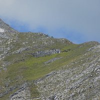 a mountain retreat seen from the trail