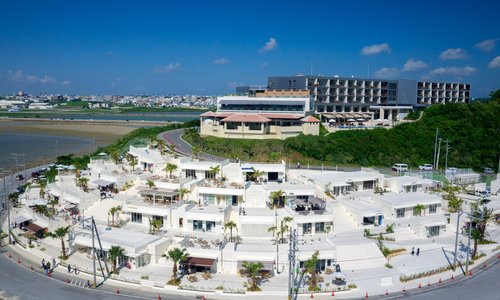 Senaga Island is the closest remote island to Naha Airport. The island is well-known as a location to both eat and shop while watching the arrival and departure of aircraft first hand while simultaneously enjoying the spectacular view as it spreads before you.
 https://www.visitokinawa.jp/destinations/islands-connected-okinawa-main-island/senaga-island