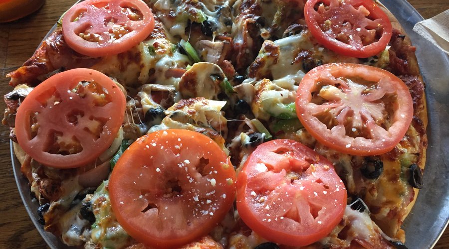 The Works Pie. Great flavor and fresh ingredients. Sorry ate one of the tomatoes before the pict