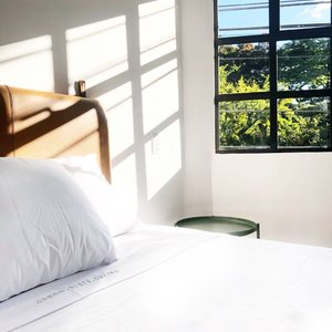 574 Hotel in Medellin, image may contain: Interior Design, Furniture, Home Decor, Bed
