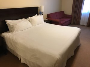 Sunshine Inn in Smithers, image may contain: Furniture, Bed, Couch, Cushion