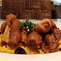 Lahm Barkook- Lamb shank simmered in caramelized onion and prune sauce