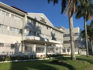 Hotel Morobe in Lae, image may contain: Hotel, Office Building, Neighborhood, Grass