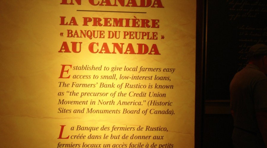 Sign describing brief hiistory of bank.