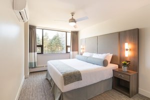 Gage Suites at UBC in Vancouver, image may contain: Corner, Ceiling Fan, Electrical Device, Furniture
