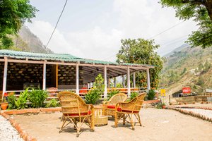 Tapovan Resort in Chamoli, image may contain: Hotel, Resort, Building, Chair