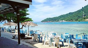 The Barat Perhentian Beach Resort in Pulau Perhentian Besar, image may contain: Scenery, Restaurant, Dining Table, Beach