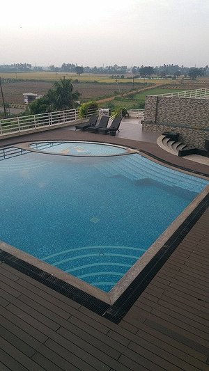 Grey Suit in Kakkavakkam, image may contain: Pool, Water, Swimming Pool, Chair