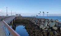 Fishing Rod Laying On A Rail At Edmonds Phishing Pier, Washington