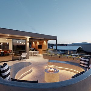 Luxury Exclusive Penthouse balcony outdoor entertaining area with fireplace, BBQ, TV & dining