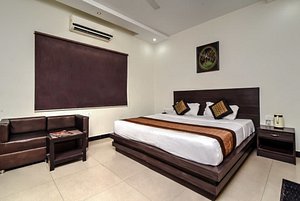 Hotel Avalon Taj in Agra, image may contain: Interior Design, Corner, Bed, Home Decor