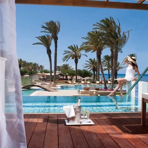 Constantinou Bros Asimina Suites Hotel in Geroskipou, image may contain: Hotel, Resort, Pool, Water