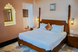 Devnadi - The Heritage Hotel in Haridwar, image may contain: Furniture, Bedroom, Bed, Indoors