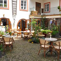 Here is our beautiful cafe courtyard oasis, far from the madding crows but right next to the bri