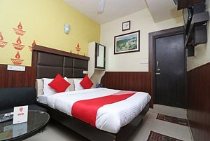 OYO 2075 Hotel Kota Royal in Kota, image may contain: Hotel, Resort, Furniture, Bed