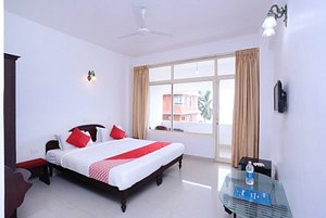 Swapnatheeram Beach Resort in Kovalam, image may contain: Corner, Ceiling Fan, Interior Design, Furniture