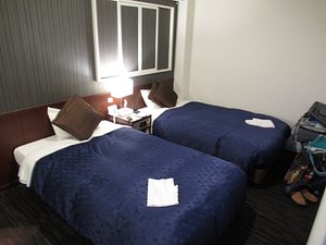 Meitetsu Inn Nagoya Ekimae in Nagoya, image may contain: Dorm Room, Furniture, Bed, Bedroom