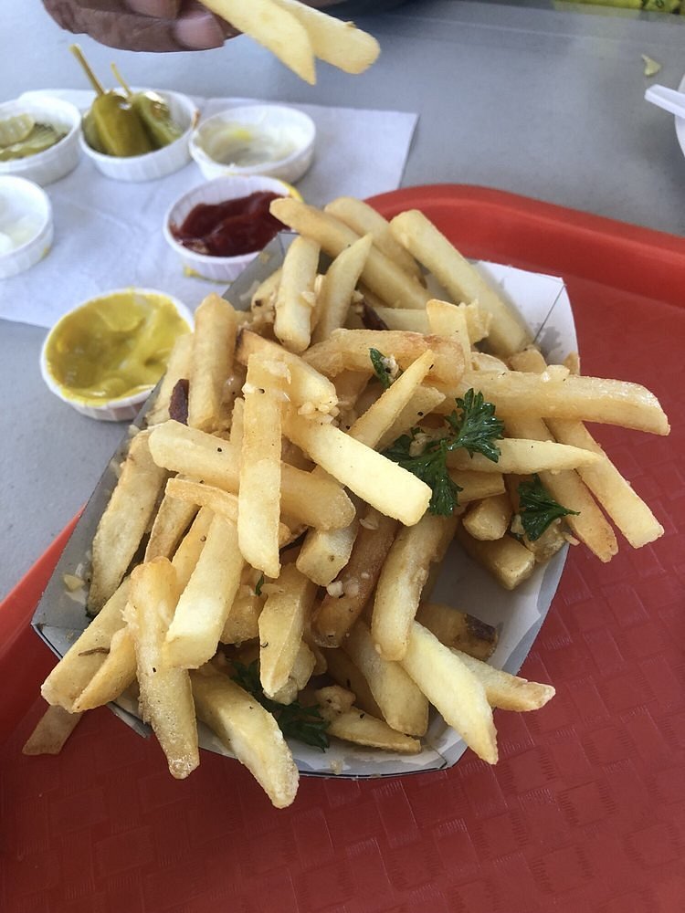 https://dynamic-media-cdn.tripadvisor.com/media/photo-o/15/06/67/cf/garlic-fries.jpg?w=1200&h=-1&s=1