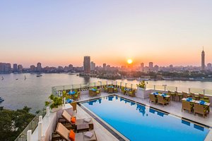 Kempinski Nile Hotel Cairo in Cairo, image may contain: Waterfront, Pool, Sky, City